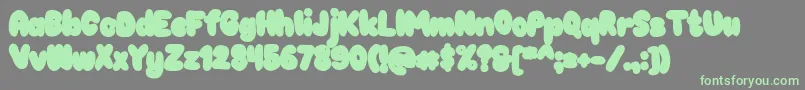 Chokooutline Font – Green Fonts on Gray Background