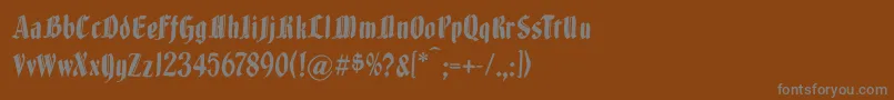 Brokenwoodtypes-fontti – harmaat kirjasimet ruskealla taustalla