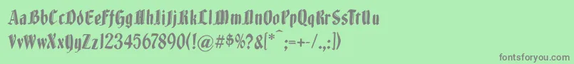 Brokenwoodtypes-fontti – harmaat kirjasimet vihreällä taustalla