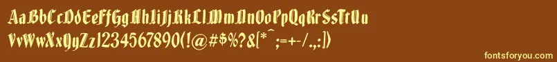 Brokenwoodtypes-fontti – keltaiset fontit ruskealla taustalla