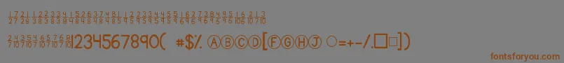 フォントKgtraditionalfractions – 茶色の文字が灰色の背景にあります。