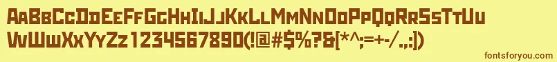 フォントRodchenkottt – 茶色の文字が黄色の背景にあります。