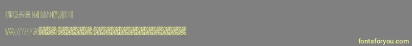 Masquerade-Schriftart – Gelbe Schriften auf grauem Hintergrund