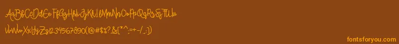 Więcej informacji o czcionce AlleanaScript Czcionka AlleanaScript – pomarańczowe czcionki na brązowym tle