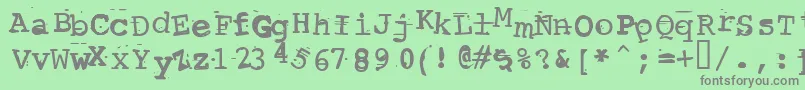 Czcionka ScrewedUpTypewriter – szare czcionki na zielonym tle