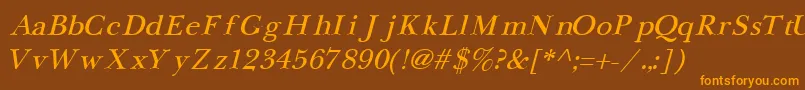 フォントNewbaskervilleCyrillicItalic – オレンジ色の文字が茶色の背景にあります。