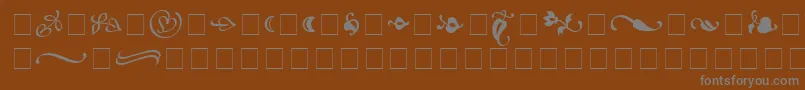 フォントAtlantixOrnamentsSsi – 茶色の背景に灰色の文字