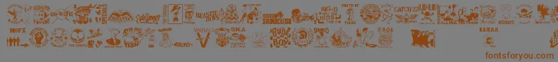 フォントStencilPunksDings – 茶色の文字が灰色の背景にあります。