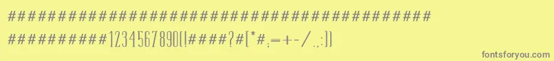 フォントTamimed – 黄色の背景に灰色の文字