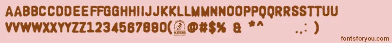 WoodcutterOligarquia Font – Brown Fonts on Pink Background