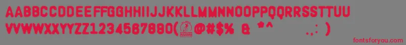 WoodcutterOligarquia Font – Red Fonts on Gray Background