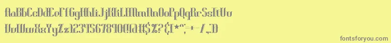 Blonirex-fontti – harmaat kirjasimet keltaisella taustalla