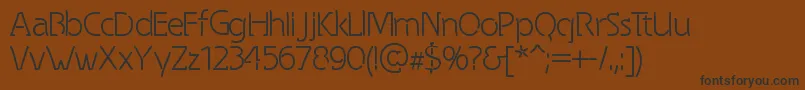 SpongyRegular Font – Black Fonts on Brown Background