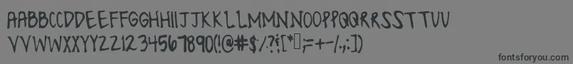 Шрифт Lonesomefont – чёрные шрифты на сером фоне