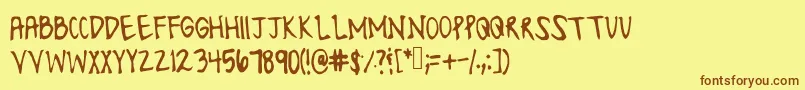 フォントLonesomefont – 茶色の文字が黄色の背景にあります。