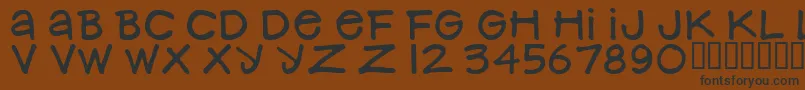 NancynayWide Font – Black Fonts on Brown Background