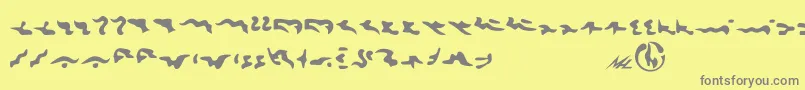 Tkon Font – Gray Fonts on Yellow Background