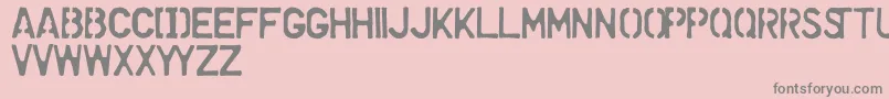 DollarStoreStencil-Schriftart – Graue Schriften auf rosa Hintergrund