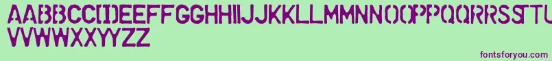 フォントDollarStoreStencil – 緑の背景に紫のフォント