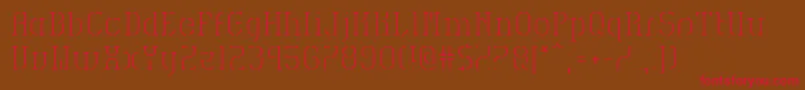フォントHvdSpencilsReg – 赤い文字が茶色の背景にあります。