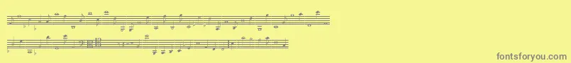 フォントLassusMedium – 黄色の背景に灰色の文字