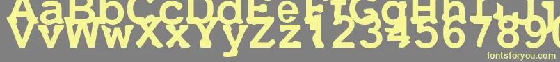 Uneek Font – Yellow Fonts on Gray Background