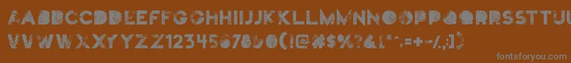 Truskey-fontti – harmaat kirjasimet ruskealla taustalla