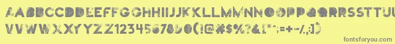 Truskey-fontti – harmaat kirjasimet keltaisella taustalla