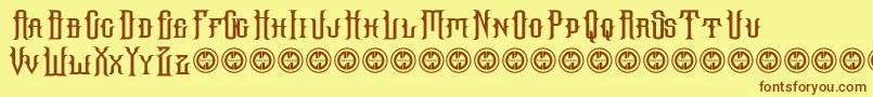 フォントHallowgrave – 茶色の文字が黄色の背景にあります。