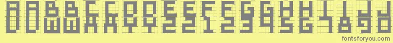 フォントSketchiquad – 黄色の背景に灰色の文字