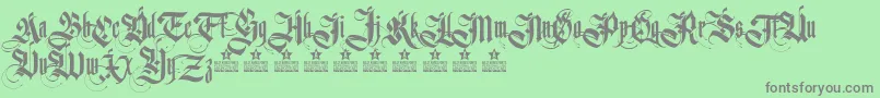 Czcionka GermanikaPersonalUse – szare czcionki na zielonym tle