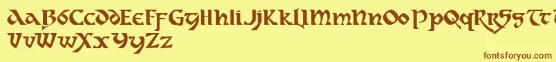 フォントDahaut ffy – 茶色の文字が黄色の背景にあります。