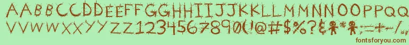 VoodooNeedles Font – Brown Fonts on Green Background