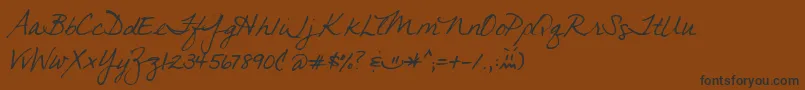 フォントJeana – 黒い文字が茶色の背景にあります