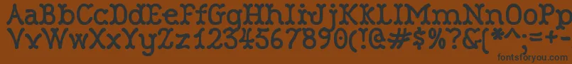 RobinneTruecase-Schriftart – Schwarze Schriften auf braunem Hintergrund