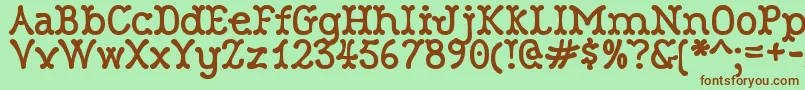 RobinneTruecase-Schriftart – Braune Schriften auf grünem Hintergrund