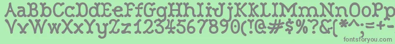 RobinneTruecase Font – Gray Fonts on Green Background