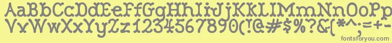 RobinneTruecase Font – Gray Fonts on Yellow Background