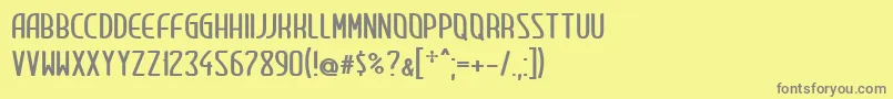 ClipCondensed-fontti – harmaat kirjasimet keltaisella taustalla