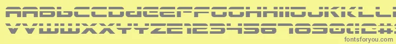 Gunship Laser-fontti – harmaat kirjasimet keltaisella taustalla