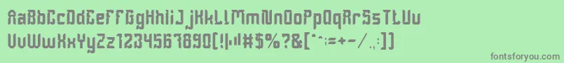 フォントDayakShield – 緑の背景に灰色の文字