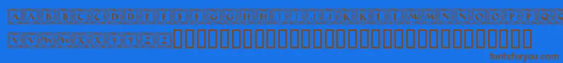 MaximilianAntiquaInitialen-fontti – ruskeat fontit sinisellä taustalla