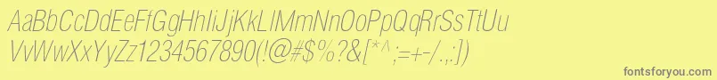 フォントHelioscondthincItalic – 黄色の背景に灰色の文字