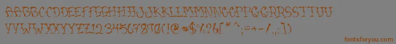 フォントVtcSumislasheronejitterybasterd – 茶色の文字が灰色の背景にあります。