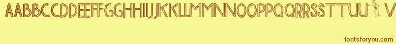BaliTolakReklamasi-fontti – ruskeat fontit keltaisella taustalla