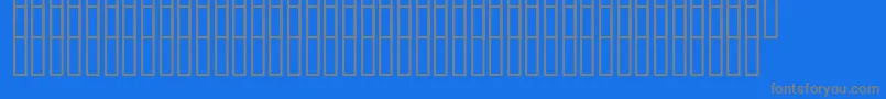 フォントUzrelief – 青い背景に灰色の文字