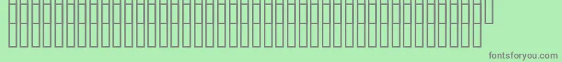 Czcionka Uzrelief – szare czcionki na zielonym tle