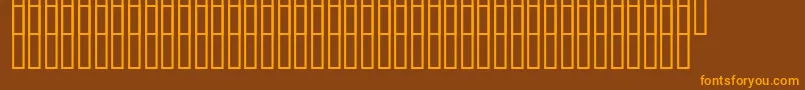 Czcionka Uzrelief – pomarańczowe czcionki na brązowym tle