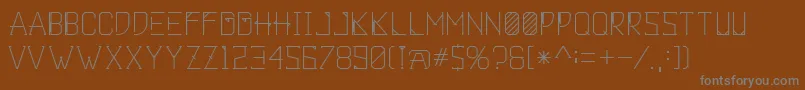 Khemala-Schriftart – Graue Schriften auf braunem Hintergrund