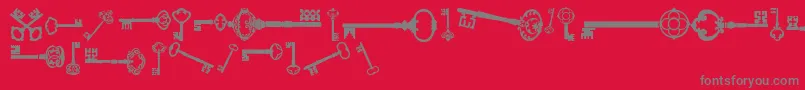 OldRetroKeysTfb-Schriftart – Graue Schriften auf rotem Hintergrund